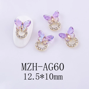 Macro view of 12.5x10mm laser butterfly nail charms with rhinestones and purple glow