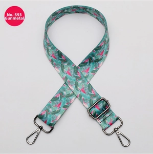 Detail of adjustable strap with flamingo print and gunmetal swivel lobster hooks