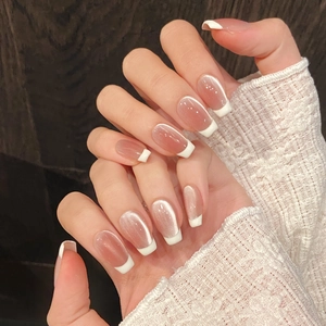 French cat eye press-on nails in nude pink with white tips and pearlescent shimmer