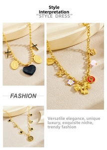 Detail of bohemian gold-plated necklaces with charms like evil eye, cross and enamel hearts