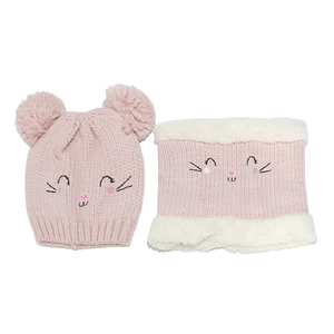 Detail of pink knitted hat and neck warmer set with cat embroidery and fluffy pom-poms