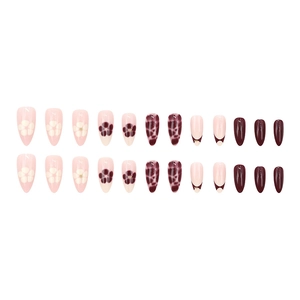 French almond press-on nails with dark brown floral patterns and leopard print accents