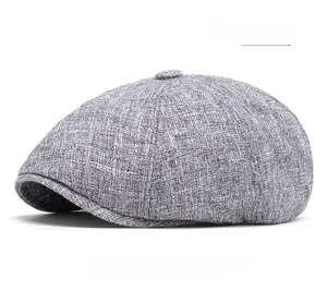 Detail shot of the dark gray newsboy cap showing textured cotton linen fabric weave