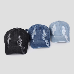 Vintage distressed denim baseball caps in black and blue shades with ripped detailing