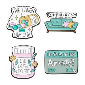Set of 4 creative cartoon enamel pins featuring mental health themes and pharmacy bottle designs