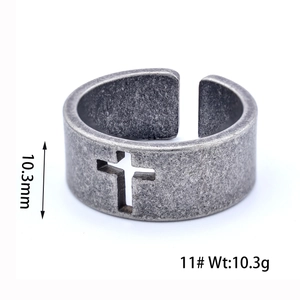 Macro detail of retro hollow cross ring with 10.3mm width and vintage silver finish