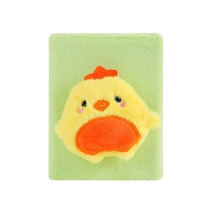 Detail of soft green plush notebook featuring a cute 3D yellow chick cartoon character