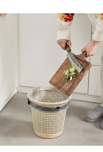 Detail of hollow plastic trash bin with black ring used for kitchen vegetable waste