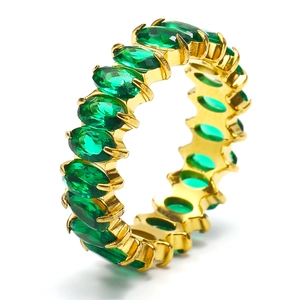 Detailed close-up of 18k gold plated ring featuring oval green emerald zircons