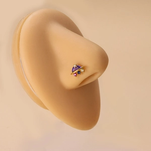 Gold planet nose stud with colorful zircon stones worn on a model, elegant facial jewelry