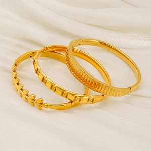 Three-piece gold plated stainless steel bangles set with leaf and geometric patterns