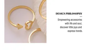 Detailed view of adjustable gold ring featuring sleek arrow and hollow heart shapes