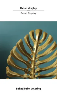 Detailed macro view of the golden monstera leaf ornament with a lacquered finish