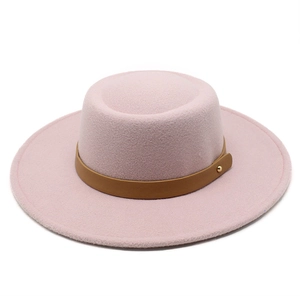 Detailed top view of pale pink flat top wool felt hat with brown leather buckle band
