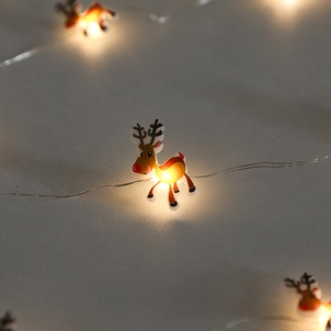 Warm yellow reindeer LED string lights for festive Christmas window decorations