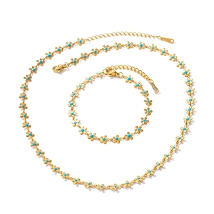 Elegant 18k gold plated titanium set featuring blue flower necklace and bracelet