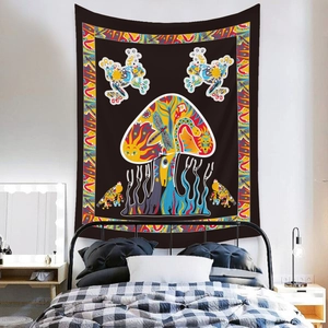 Detailed view of bohemian mushroom tapestry with vibrant frog and sun print on bedroom wall