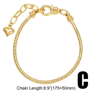 Detailed view of gold snake chain bracelet with heart pendant and 8.9 inch size label