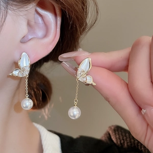 Elegant gold butterfly drop earrings with shiny zircon inlay and white pearl pendant
