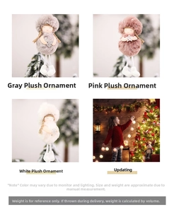 Detail of cute plush Christmas angel dolls in grey, pink, and white with heart accents