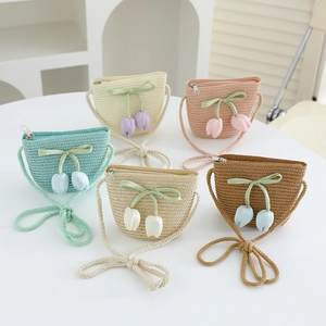 Detailed view of mini woven bags with lace ribbons and tulip pendants in five colors