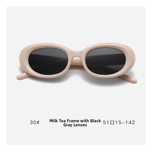 Detailed view of beige oval cat eye sunglasses frame with grey lenses and size markings