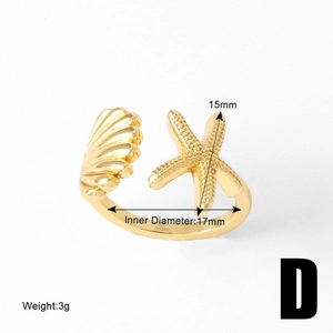 Detail of gold starfish and seashell open ring showing dimensions and 3g weight