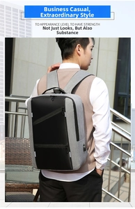Business laptop backpack in grey and black with external USB charging port and zipper pockets