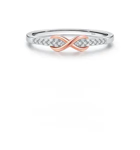Macro shot of S925 silver Mobius ring showing infinity symbol with pavé crystals