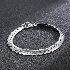 Detail view of silver stainless steel Cuban link bracelet with classic lobster clasp