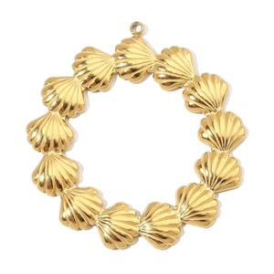 Detailed close-up of golden shell-shaped metal components linked into a circular pendant