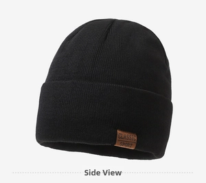 Detail of black knitted beanie showing fine texture and brown Classic Sport leather patch