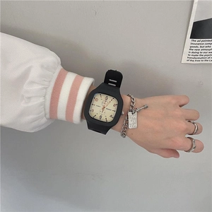 Close-up of a stylish square waterproof watch with silicone strap on a girl's wrist