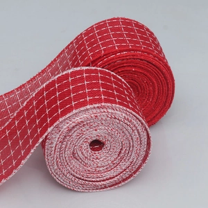 Detailed macro view of red and white checkered fabric ribbon for Christmas gift wrapping