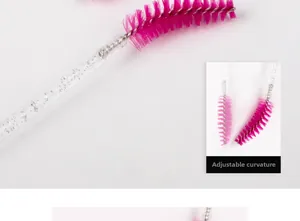 Macro detail of rose red spiral eyelash brush with flexible head and glitter handle