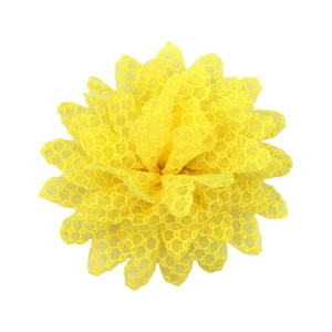 Detailed macro view of a 11cm yellow lace sunflower hair accessory with mesh texture