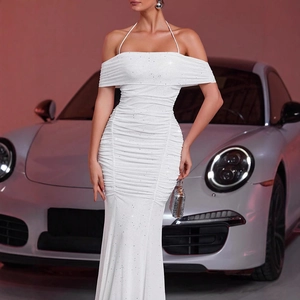 Detail of white shimmering off-shoulder evening gown with sequins and ruching