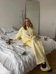 Women's pale yellow sports set with half-zip sweatshirt and wide-leg jogger pants