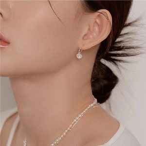 925 silver heart dangle earrings with pearls shown on model for an elegant look