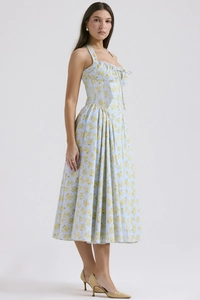 Detail view of the floral print and side profile of the summer halter neck maxi dress