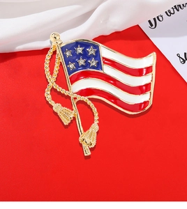 Detail of USA flag brooch with red white blue enamel and sparkling crystal stars