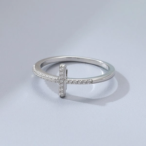 Macro detail of 925 silver double-layer cross ring with micro-paved cubic zirconia
