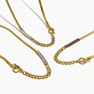 Gold-plated OT clasp necklace with snake chain and colorful zircon stones on white background