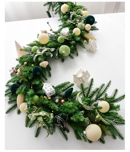Detail of 1.8m Christmas garland with PE needles, white ceramic houses and warm LED lights