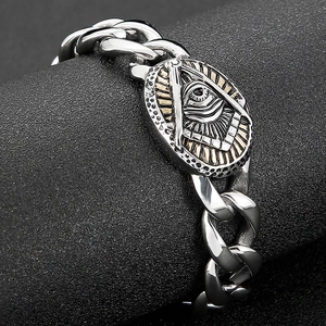 Macro view of retro stainless steel Cuban chain with two-tone relief charm detail