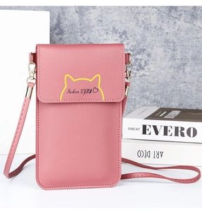 Detailed view of a pink crossbody cell phone bag featuring cute cat ear design and gold accents