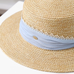 Elegant French straw sun hat with light blue ribbon and lace trim in a 45-degree view