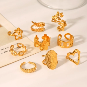 9-piece gold-plated stainless steel ring set with heart, leaf, and flower patterns