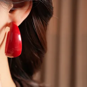 Vintage glossy red C-shape resin earrings with silver needles for stylish women