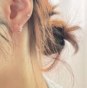 Minimalist S925 sterling silver knot hoop earring and ball stud set worn on ear
